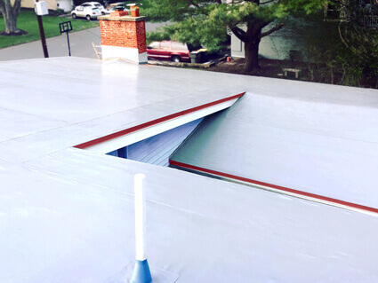 ID Flat Roof team and work vehicle in Wellesley